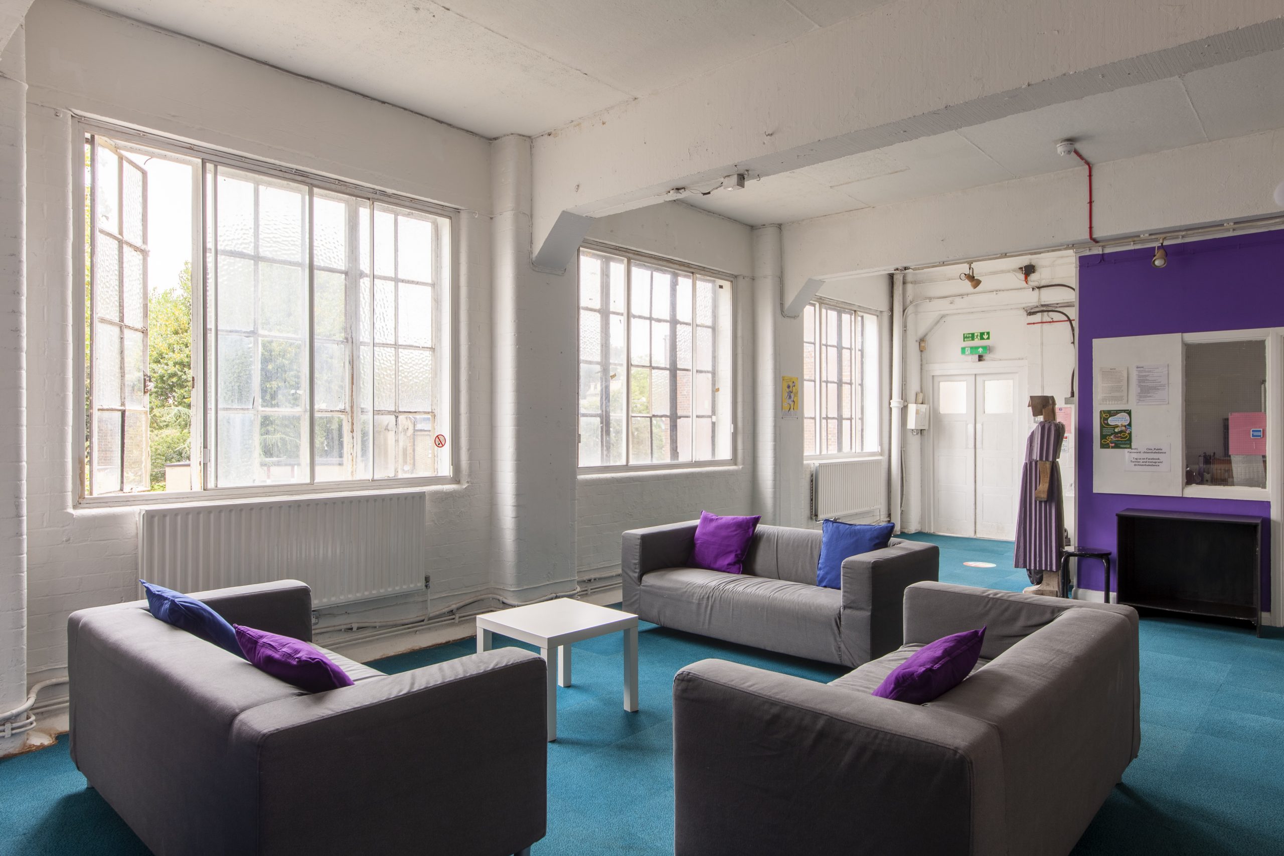 Image of three grey sofas in the Chisenhale Dance Space lounge
